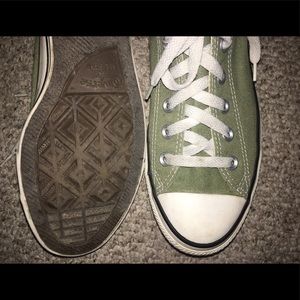 Light olive green low top converse.